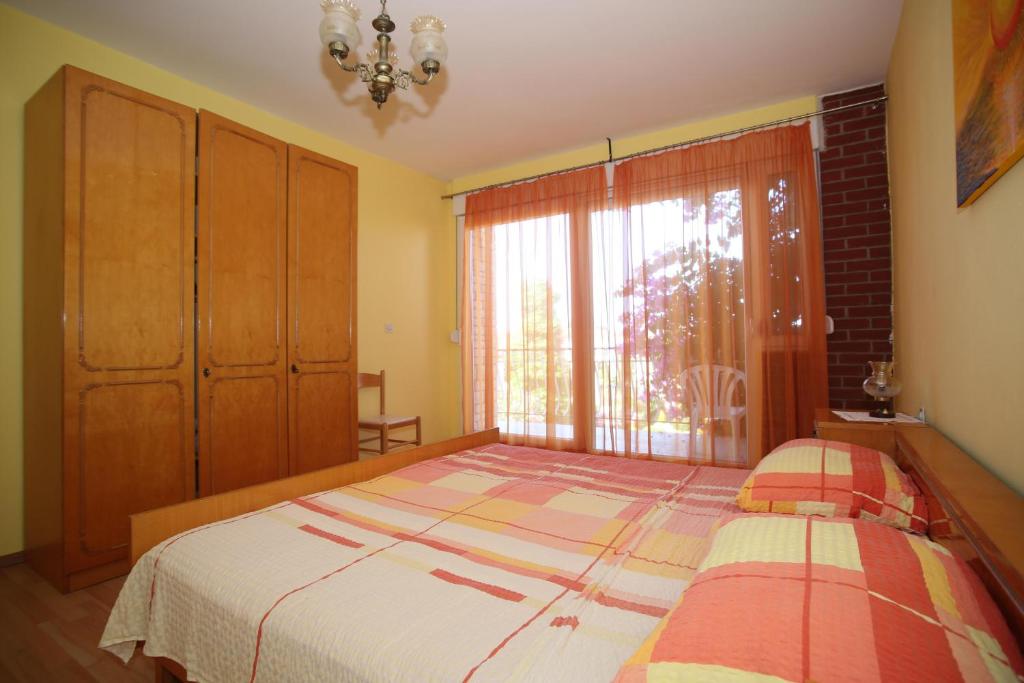 Łóżko lub łóżka w pokoju w obiekcie Apartment Michelle
