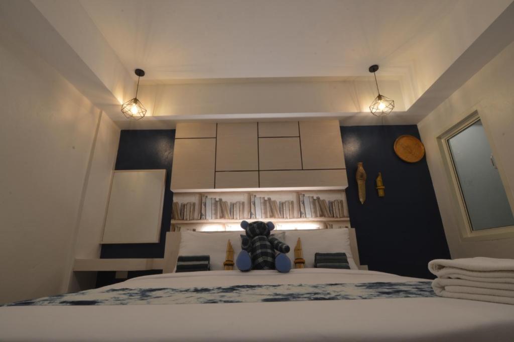 Postel nebo postele na pokoji v ubytování UD Capital Hotel
