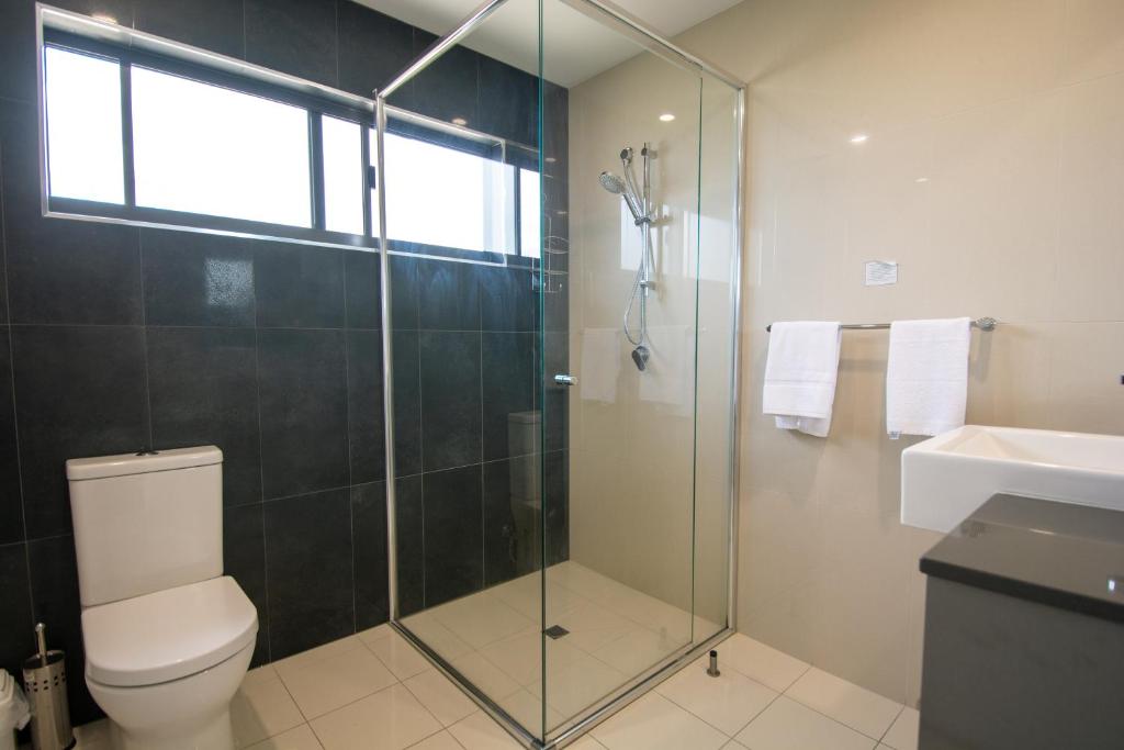 Kopalnica v nastanitvi Magnum Serviced Apartments