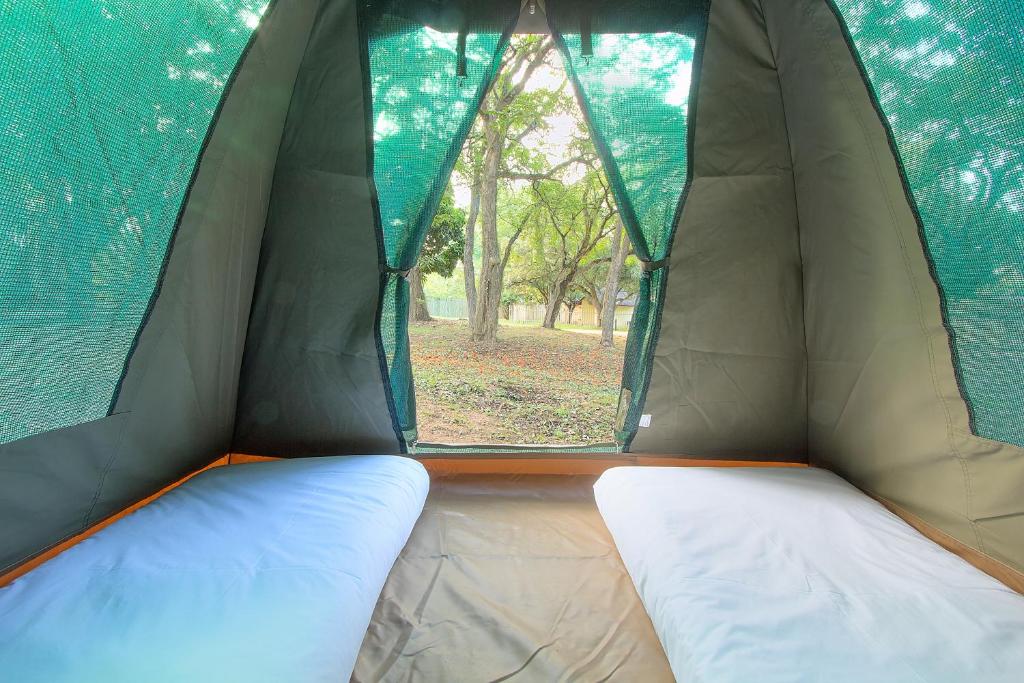 Voodi või voodid majutusasutuse Kruger Adventure Lodge toas