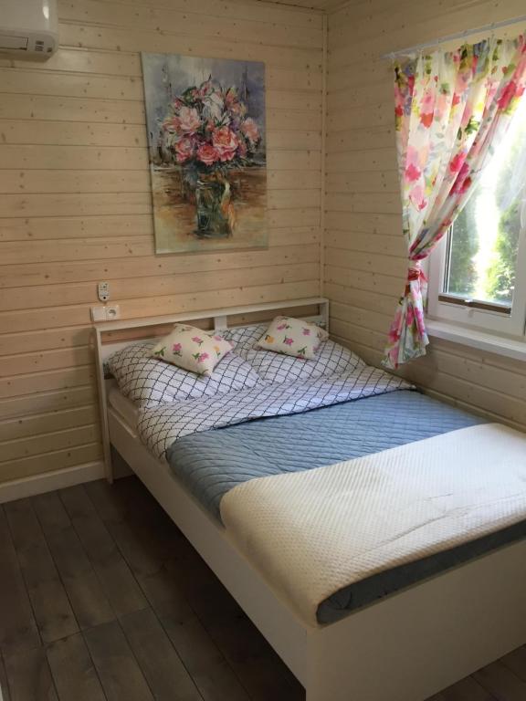 Postel nebo postele na pokoji v ubytování Domki Mechelinki