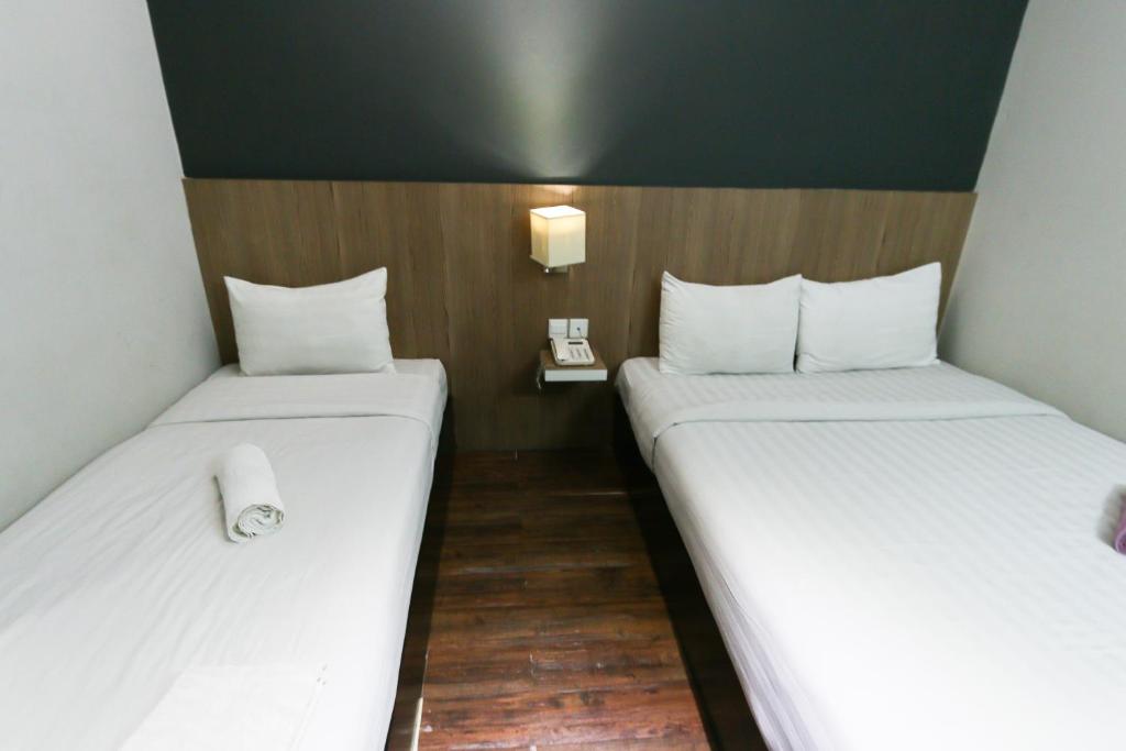 Postel nebo postele na pokoji v ubytování Hotel 99 Botanik Klang