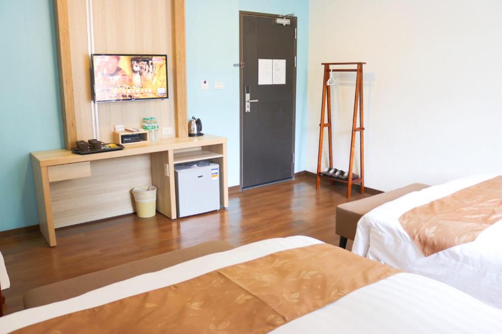Postel nebo postele na pokoji v ubytování Fungo Hotel