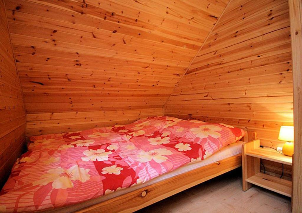 Postel nebo postele na pokoji v ubytování Sztil - Apartamenty i drewniane domki