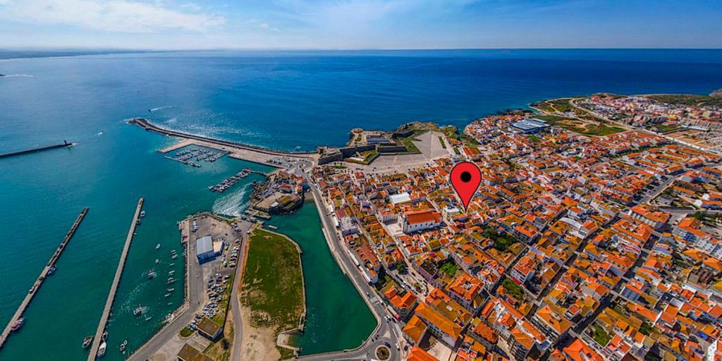 an aerial view of a city with a red marker at Casa Vintage Guest House in Peniche