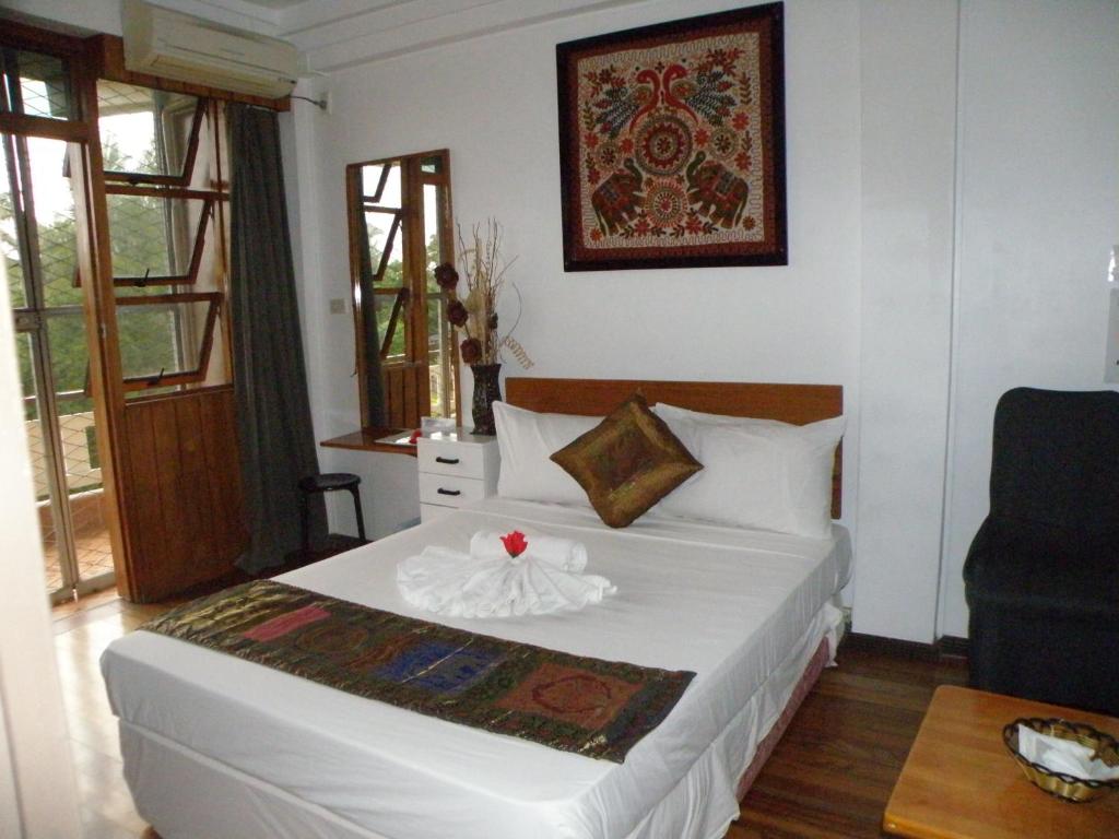Postel nebo postele na pokoji v ubytování Tagimoucia House Hotel