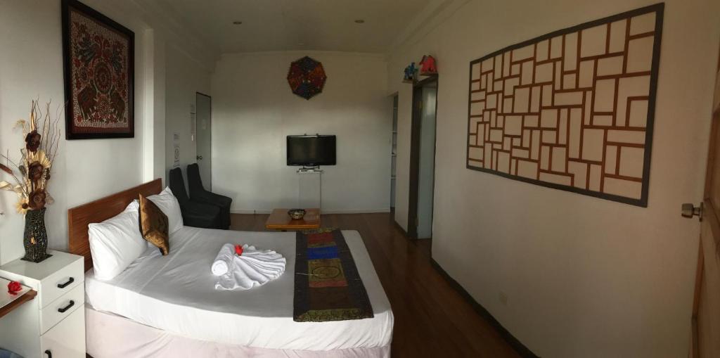 Postel nebo postele na pokoji v ubytování Tagimoucia House Hotel