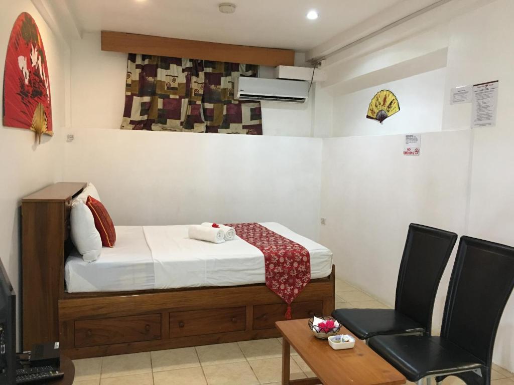 Postel nebo postele na pokoji v ubytování Tagimoucia House Hotel