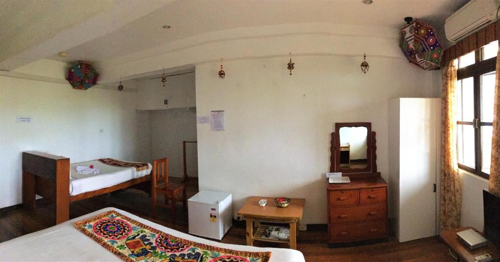 Postel nebo postele na pokoji v ubytování Tagimoucia House Hotel