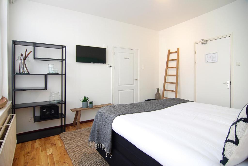 Postel nebo postele na pokoji v ubytování Hotel Zand
