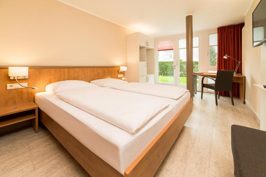 Postel nebo postele na pokoji v ubytování Hotel Spree-idyll