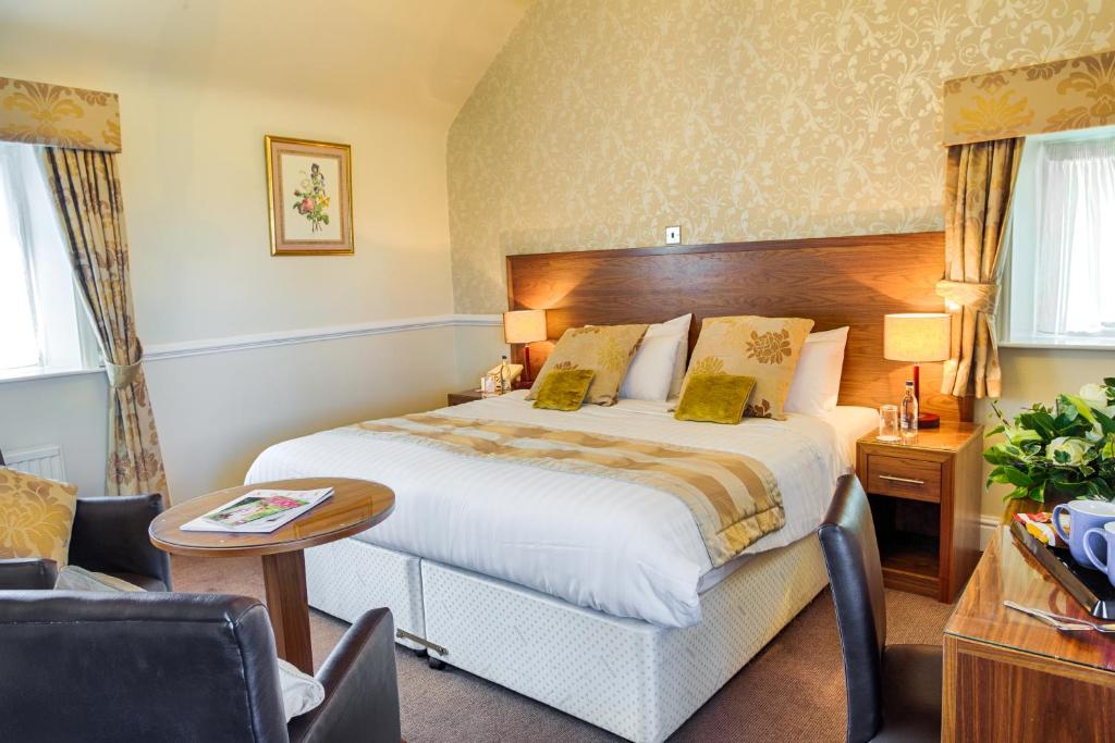 Postel nebo postele na pokoji v ubytování Bagden Hall Hotel