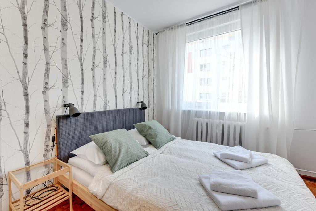 Posteľ alebo postele v izbe v ubytovaní Gdańsk Comfort Apartments Wejhera