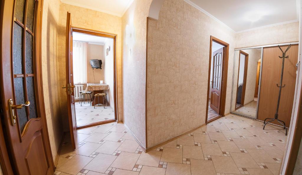 a hallway with two doors and a tiled floor at Clean and comfortable apartments on Karl Marx street in Tiraspol