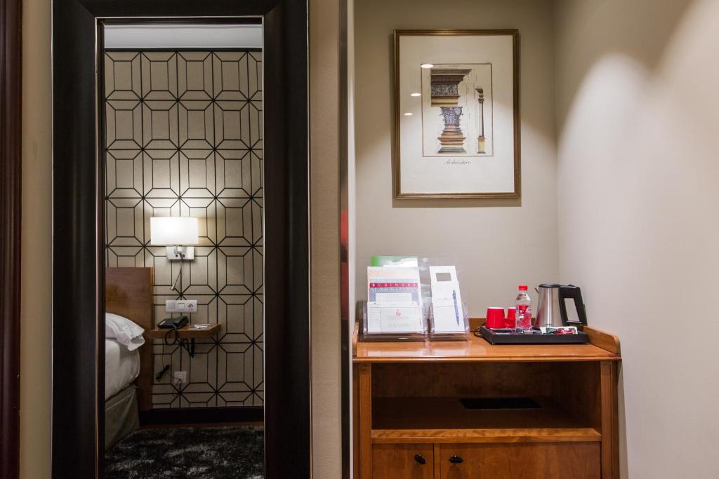 Postel nebo postele na pokoji v ubytování Hotel Carlton