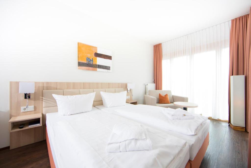Postel nebo postele na pokoji v ubytování Hotel Saxenhof