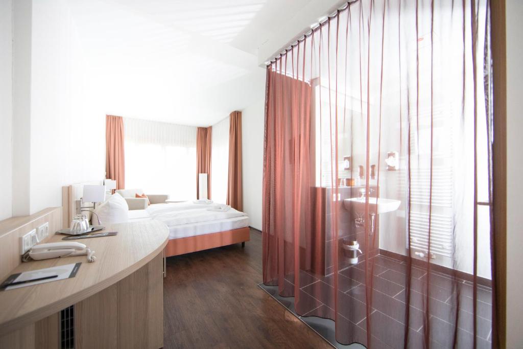 Postel nebo postele na pokoji v ubytování Hotel Saxenhof