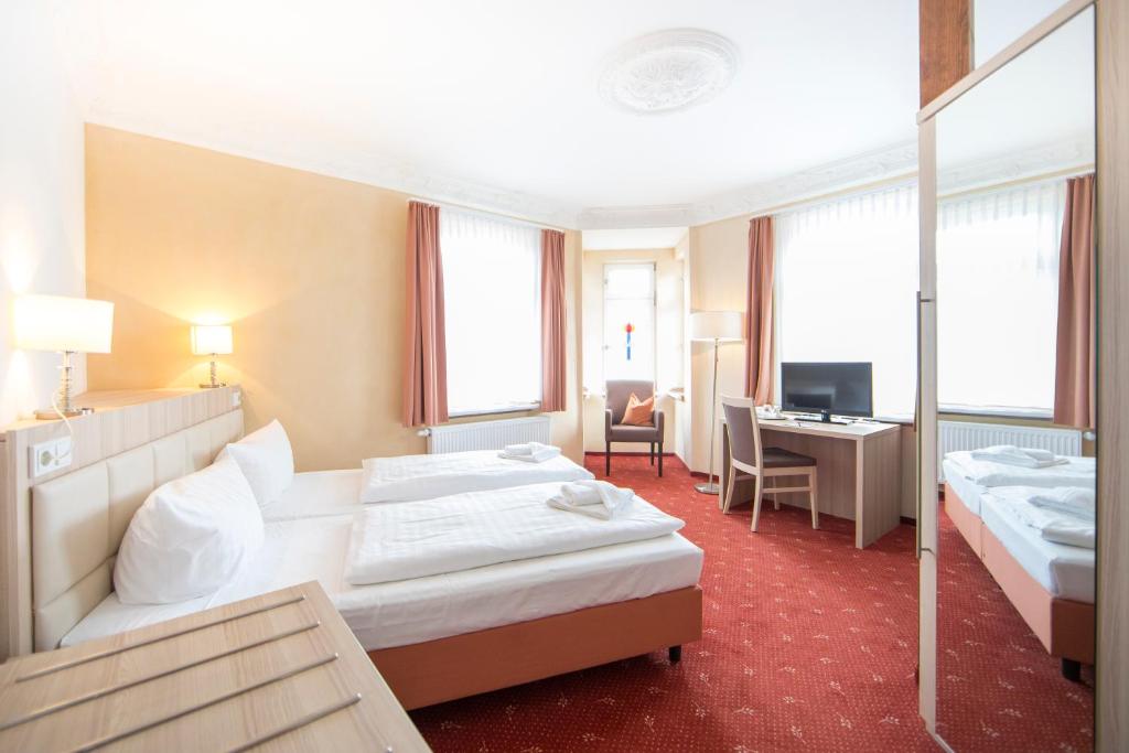 Postel nebo postele na pokoji v ubytování Hotel Saxenhof