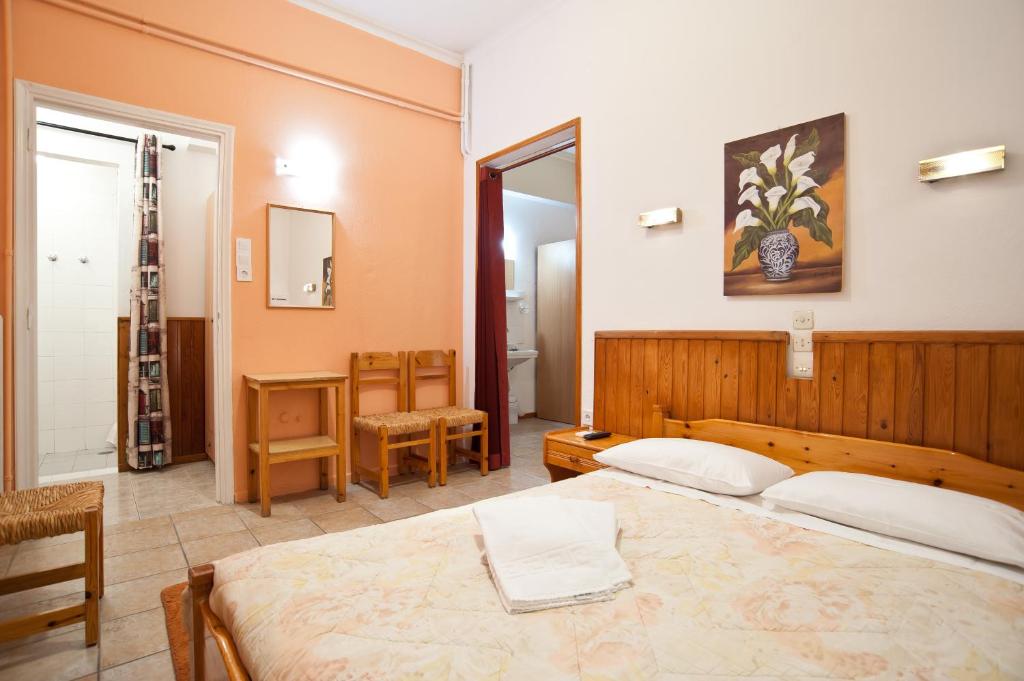 Postel nebo postele na pokoji v ubytování Hotel Athina