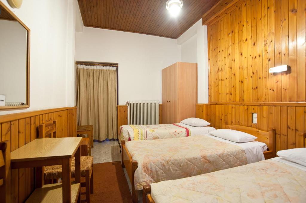 Postel nebo postele na pokoji v ubytování Hotel Athina