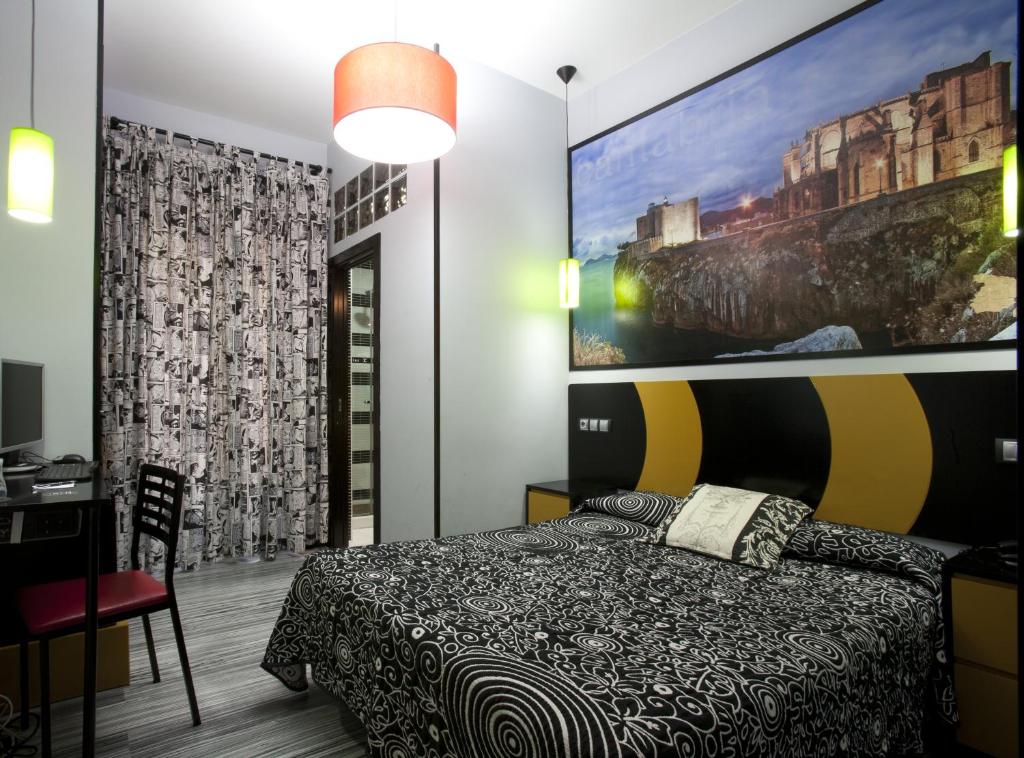Postel nebo postele na pokoji v ubytování JC Rooms Santa Ana