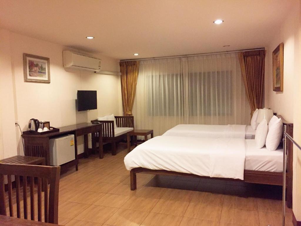 Ліжко або ліжка в номері Chan Chiangmai House
