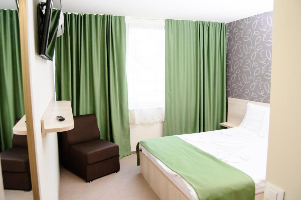 Postel nebo postele na pokoji v ubytování Hotel Doina