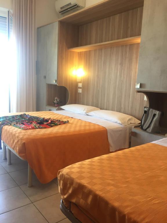 Postel nebo postele na pokoji v ubytování Hotel Ridens