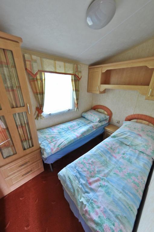Postel nebo postele na pokoji v ubytování Camping KamA