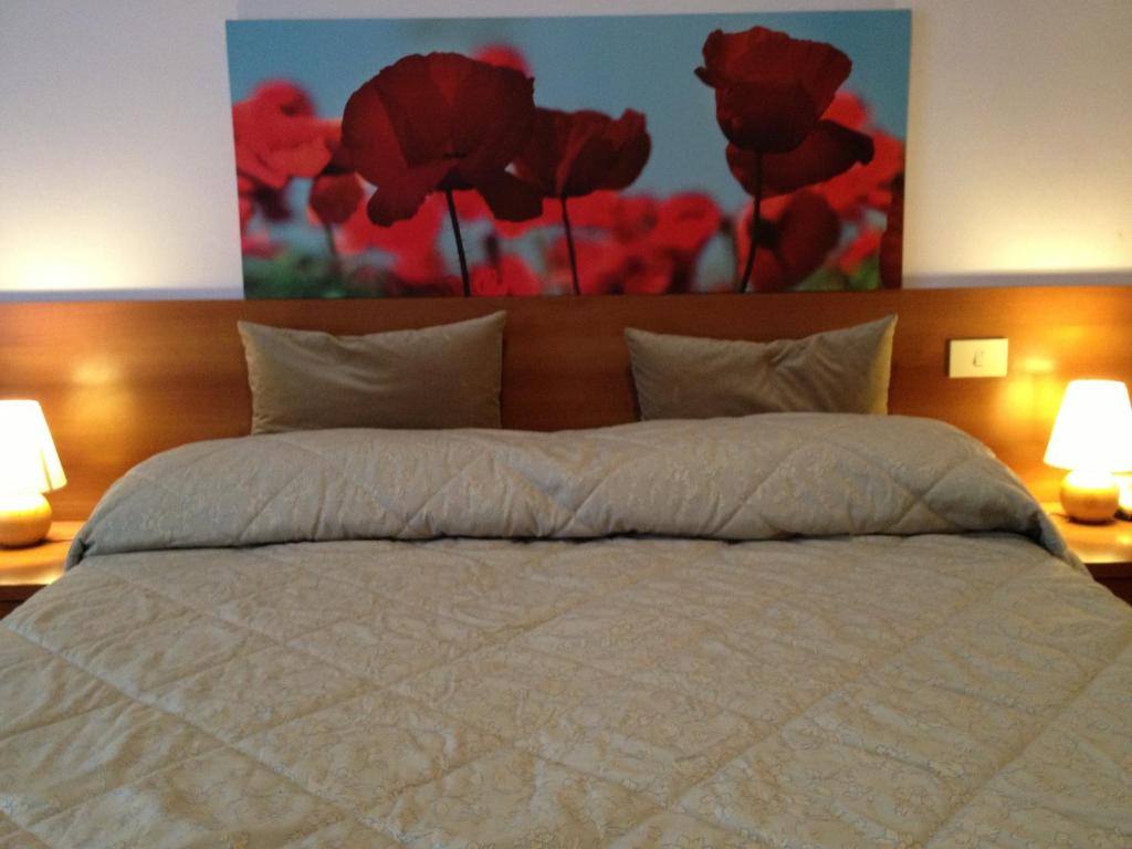 Postel nebo postele na pokoji v ubytování Hotel Indicatore
