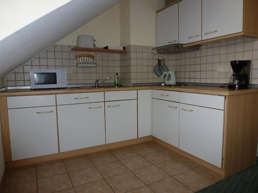 Kuchyň nebo kuchyňský kout v ubytování Appartements Leibold