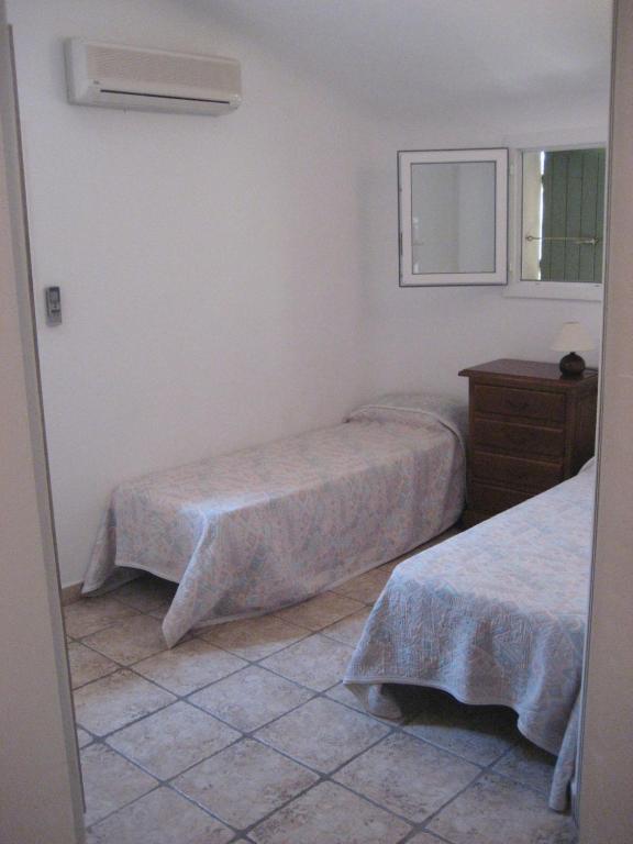 Postel nebo postele na pokoji v ubytování Residence ISULA DI I CORSI
