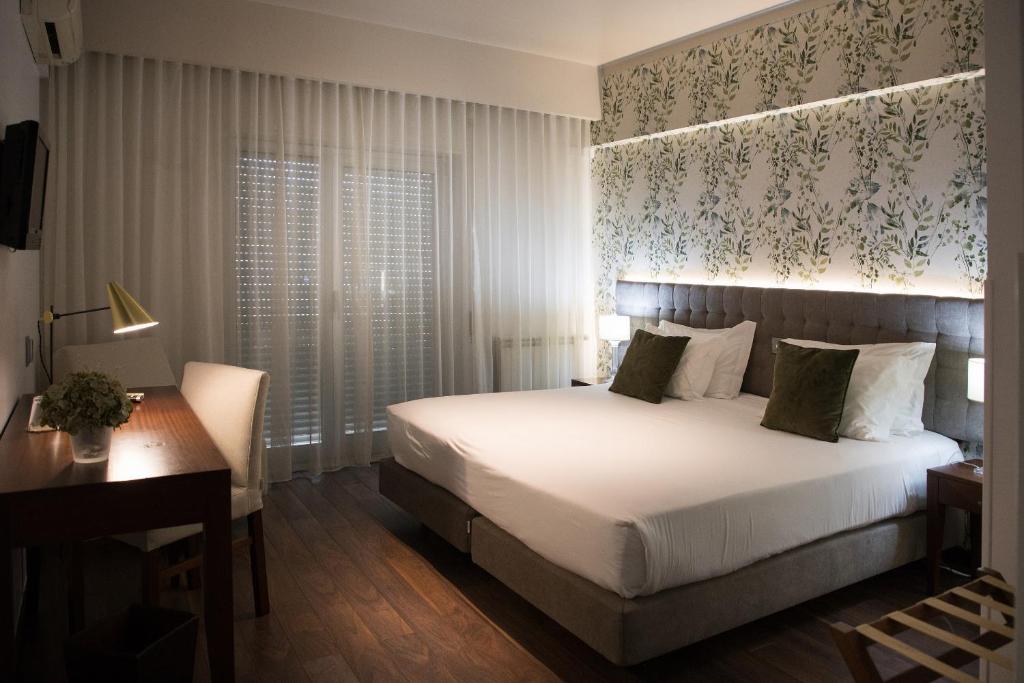 Postel nebo postele na pokoji v ubytování Belem Hotel
