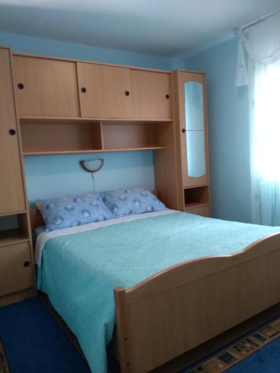 Postel nebo postele na pokoji v ubytování Apartments Anić