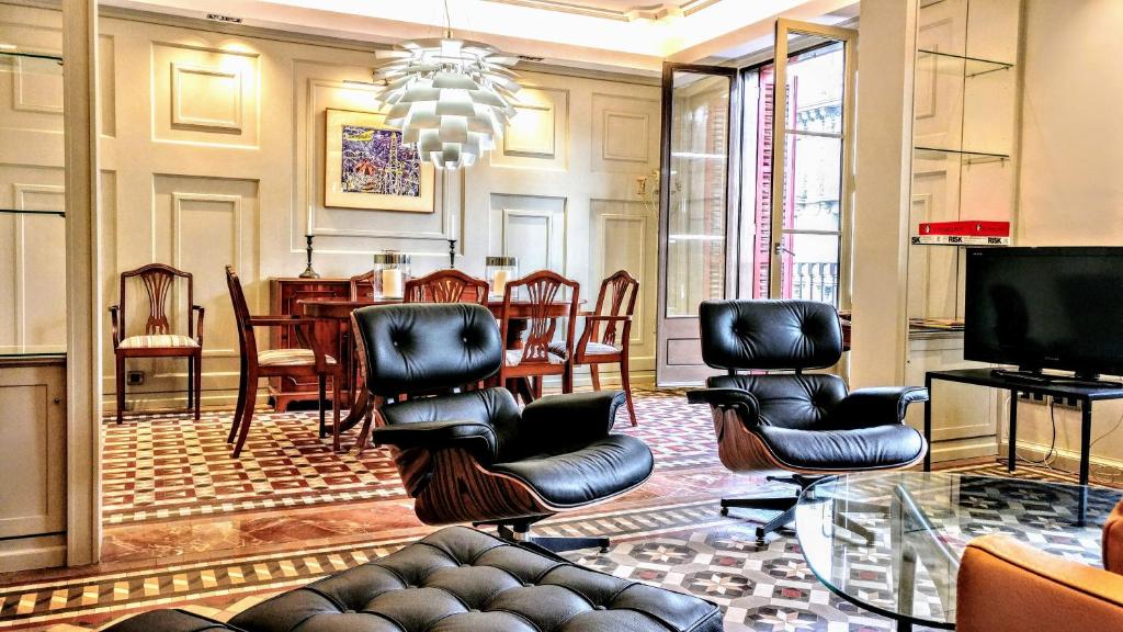 Televízia a/alebo spoločenská miestnosť v ubytovaní BizFlats Eixample Apartments