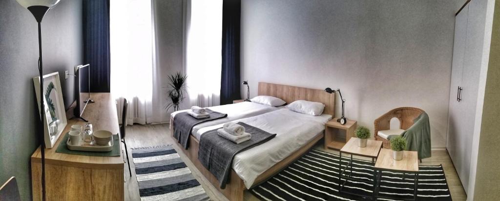 Postel nebo postele na pokoji v ubytování Arhiv Boutique House