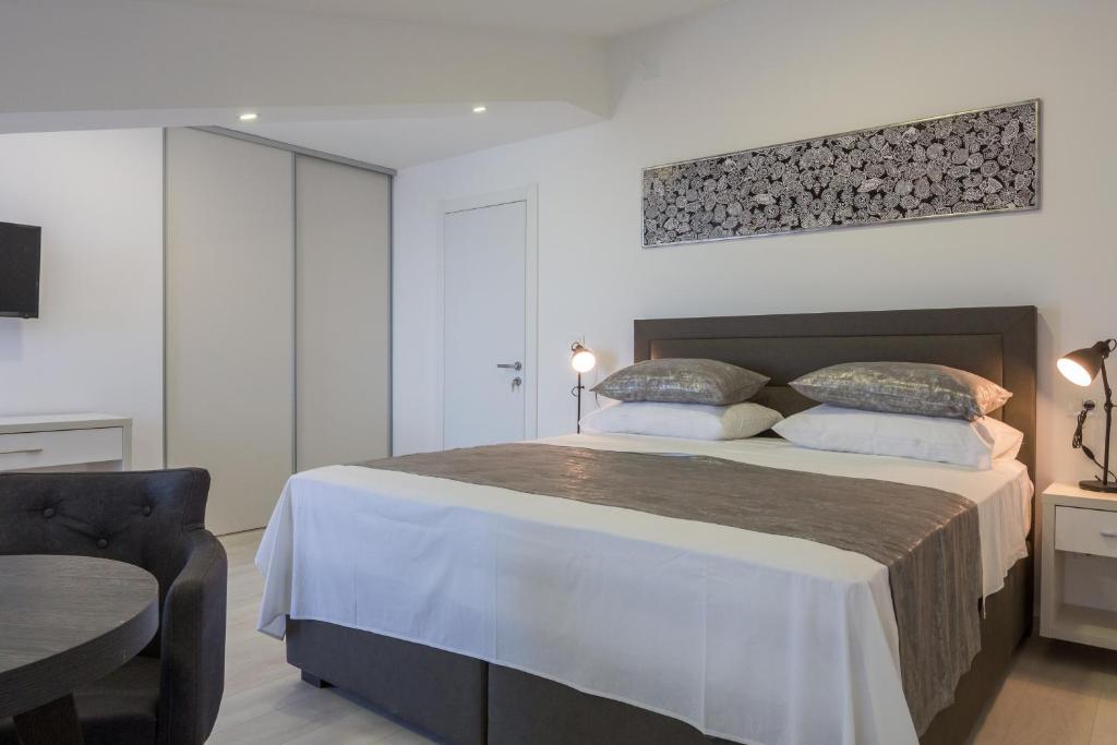 Ein Bett oder Betten in einem Zimmer der Unterkunft Villa Mandalinic