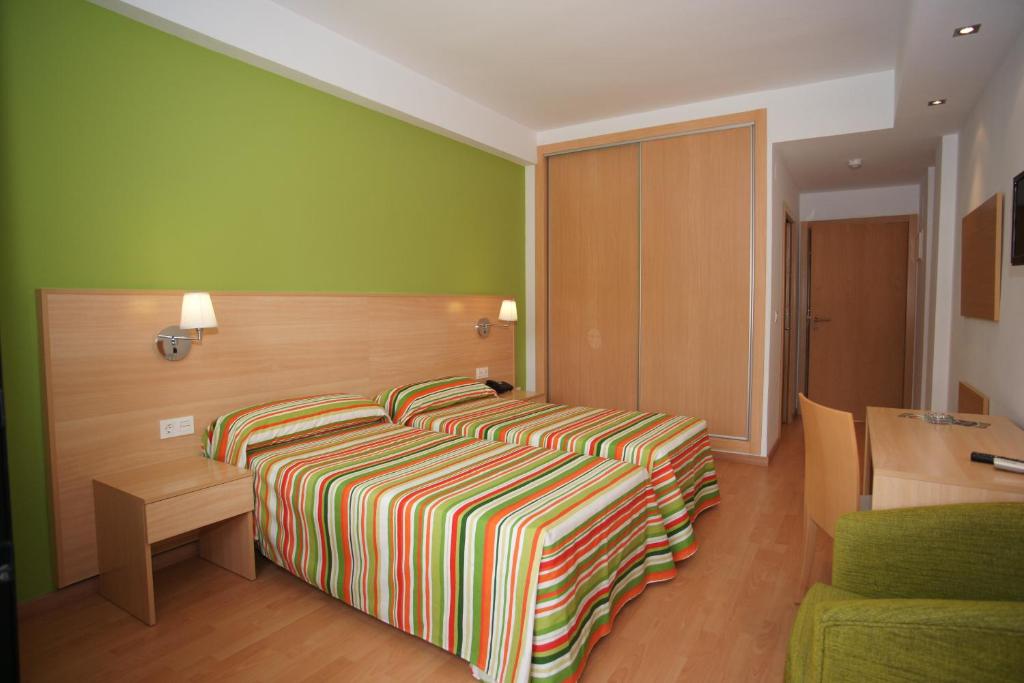 Postel nebo postele na pokoji v ubytování Hotel Golden