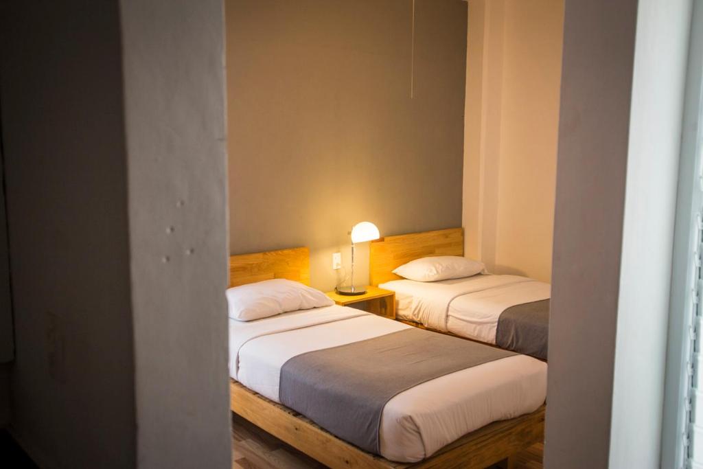 Postel nebo postele na pokoji v ubytování Hostal Tres Central