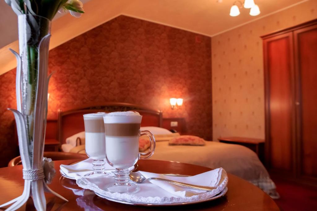 Postel nebo postele na pokoji v ubytování Hotel Elefant