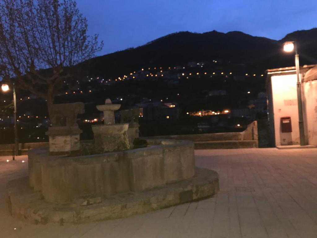 a monument with a view of a city at night at Hotel Bonadies in Ravello