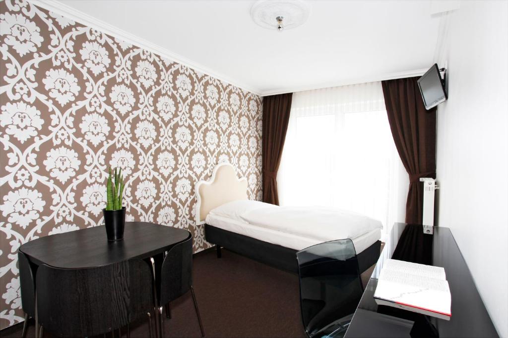 Postel nebo postele na pokoji v ubytování Hotel Apartment Laforsch