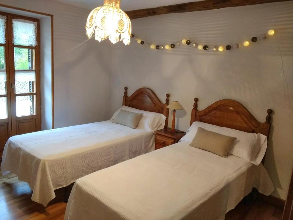 Postel nebo postele na pokoji v ubytování Bentzuntzibar