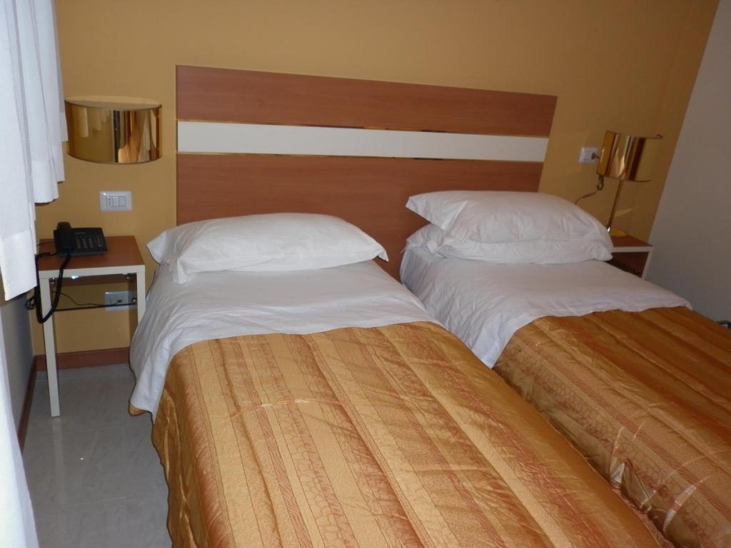 Postel nebo postele na pokoji v ubytování Hotel GF