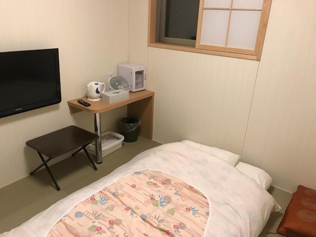 Postel nebo postele na pokoji v ubytování Hotel Famitic Nikko Station
