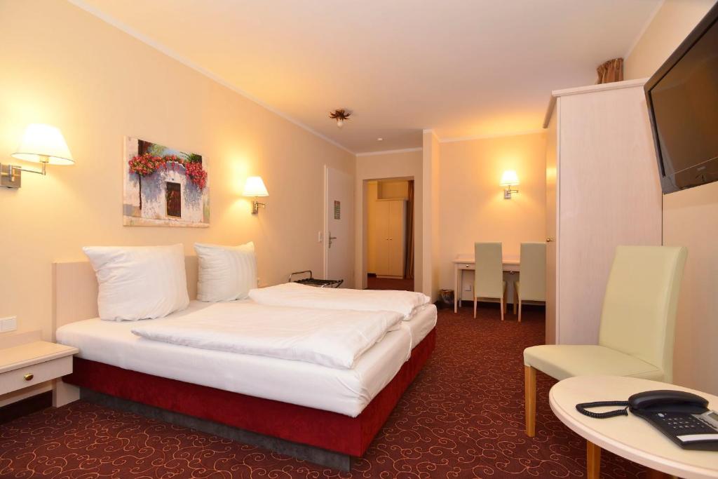 TV a/nebo společenská místnost v ubytování Hotel Behrmann