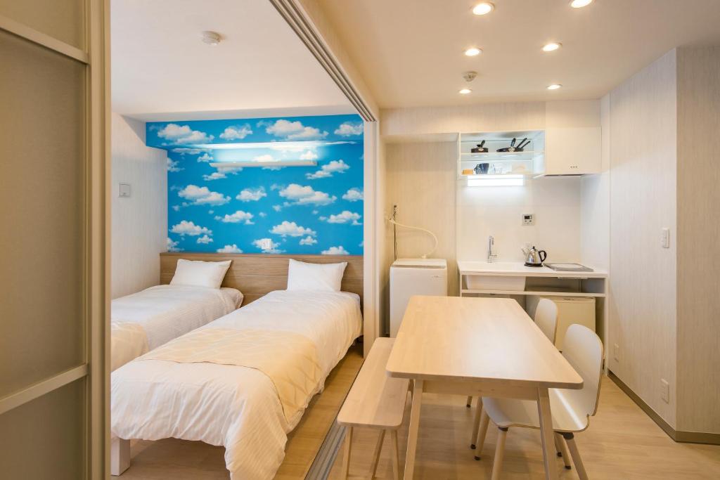 Postel nebo postele na pokoji v ubytování Hotel SAILS