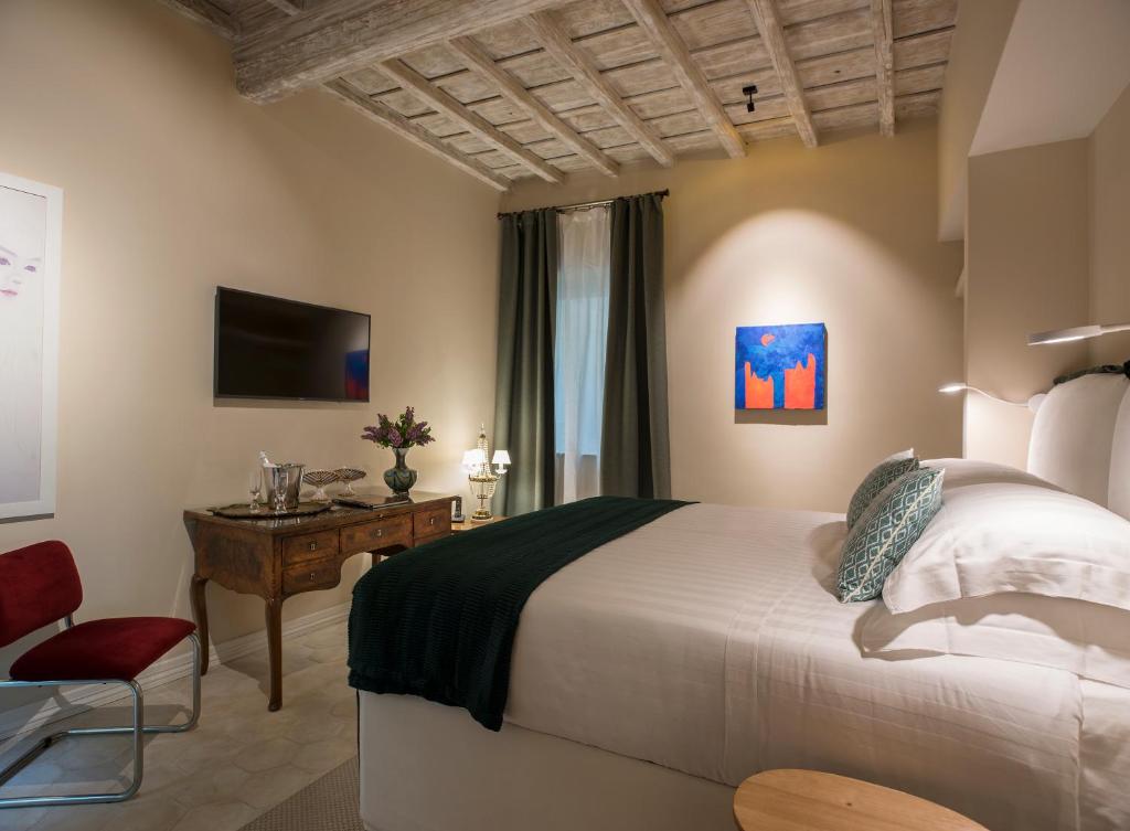 Postel nebo postele na pokoji v ubytování Palazzo Caruso