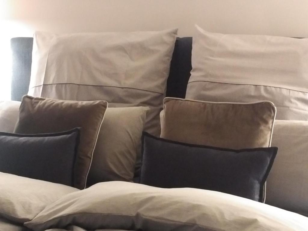 a pile of pillows sitting next to each other at Ferienhaus Pfaffensee in Harthausen
