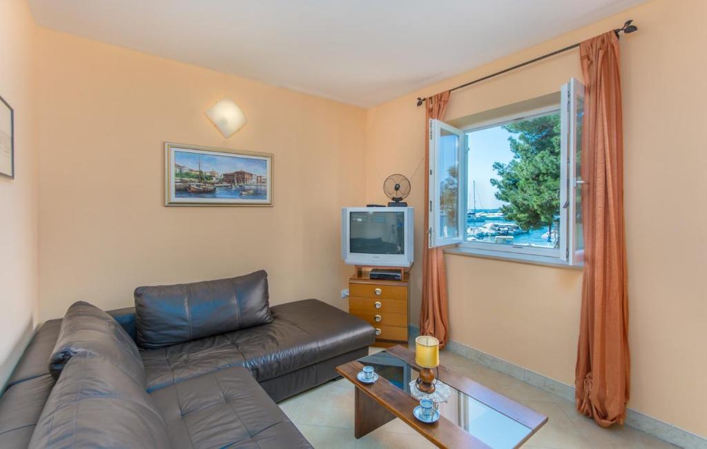 Telewizja i/lub zestaw kina domowego w obiekcie Apartment Riva Porec